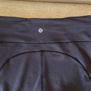 Lululemon Black Leggings Size 8. Two pockets in front. LULU label on back.